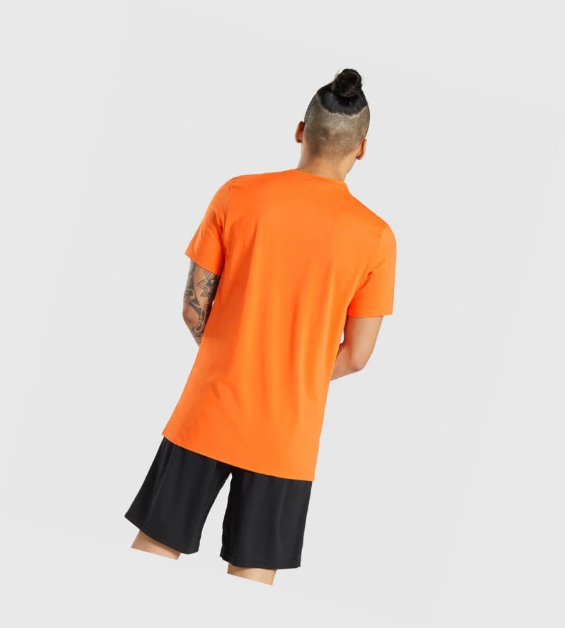 Camiseta Gymshark Arrival Hombre Naranjas | UKQBRFE-60