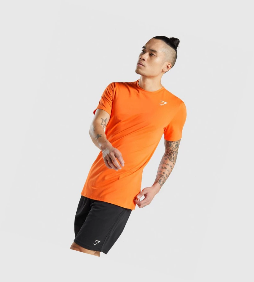 Camiseta Gymshark Arrival Hombre Naranjas | UKQBRFE-60