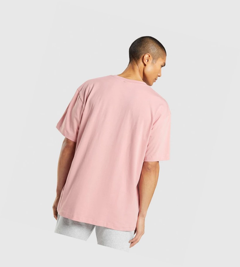 Camiseta Gymshark Central Oversized Hombre Rosas | IDXKVUG-61