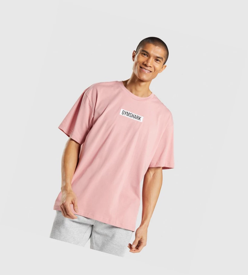 Camiseta Gymshark Central Oversized Hombre Rosas | IDXKVUG-61